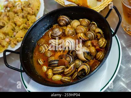 Escargots. Spanische Küche Stockfoto