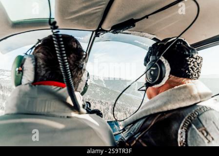 Sheregesh, Russia, 9 January 2021, pilots fly passenger small plane inside the cockpit Stockfoto