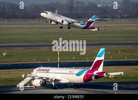 Flughafen Düsseldorf, Eurowings-Flugzeuge auf dem Vorfeld und startend, Nordrhein-Westfalen, Deutschland Stockfoto
