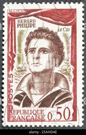 Von Frankreich gedruckte gestempelte Briefmarke, das Porträt von Gerard Philipe (1922–1959) in der Rolle des El Cid, um 1961. Stockfoto