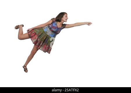 Schöne junge Frau, die in der Luft schweben Stockfoto
