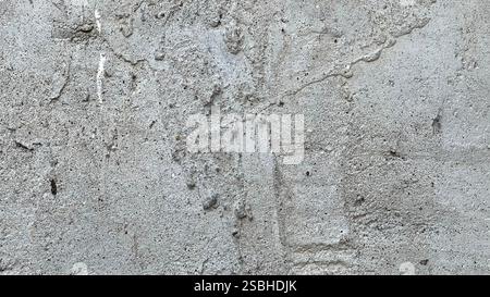Nahansicht einer Betonwand mit rauer Textur und subtilen Mustern. Stockfoto