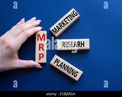 IRR - Internal Rate of Return symbol. Concept word IRR on wooden cubes. Businessman hand. Beautiful deep blue background. Business and IRR concept. Co Stockfoto
