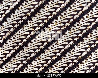 Ethnisch-traditionelles Batikmuster in zufälligen Ornamentformen. Batik ist eine authentische Kunst aus Indonesien mit vielen unbegrenzten zufälligen ornamentalen, floralen Stockfoto