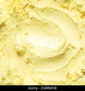 Gelbe Mangofrucht-Eiscreme-Textur als Hintergrund. Bananen-Kokos gefrorener Joghurt aus nächster Nähe. Stockfoto