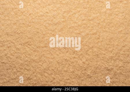 Nahaufnahme des Baumwoll- und Polyestergewebes eines beigen Pullovers Stockfoto