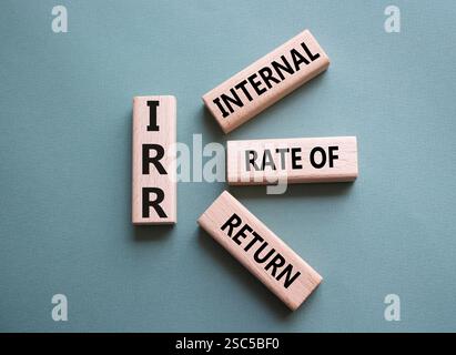 IRR - Internal Rate of Return symbol. Concept word IRR on wooden cubes. Beautiful grey green background. Business and IRR concept. Copy space. Stockfoto