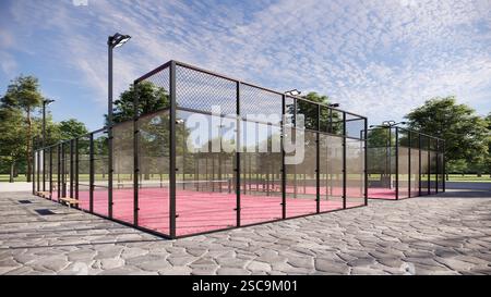 Eckblick auf den Padel Court im Freien mit rosafarbener Oberfläche, ausgestattet mit Flutlichtern und Glas Stockfoto