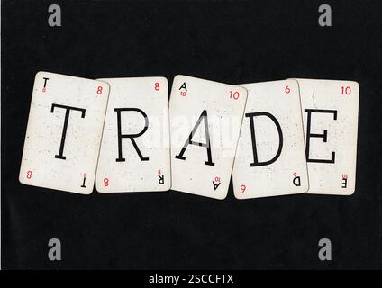 Vintage-Wortspiel-Karten, die HANDEL auf schwarzem Hintergrund schreiben. Stockfoto