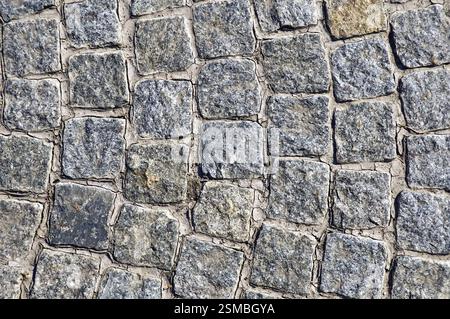 Die Textur der rauhen grauer Granit quadratischen Kacheln Stockfoto