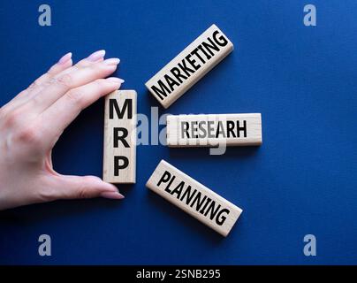 IRR - Internal Rate of Return symbol. Concept word IRR on wooden cubes. Businessman hand. Beautiful deep blue background. Business and IRR concept. Co Stockfoto