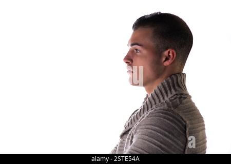 Profil eines attraktiven jungen Mannes mit grauem Jersey Stockfoto