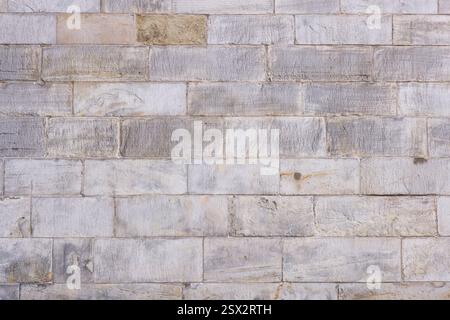 Nahaufnahme einer alten Steinmauer. Hintergrund, Muster oder Textur im Vollformat Stockfoto