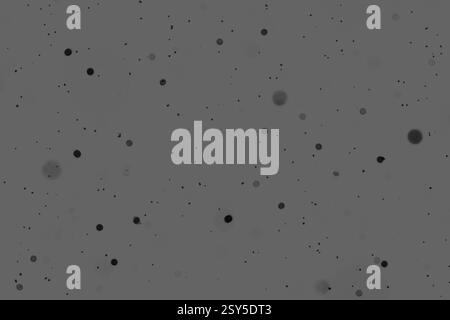 Abstrakter monochromer Hintergrund mit Streupartikelmuster Stockfoto