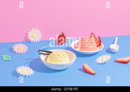 Vanille- und Erdbeereis in weißen Schüsseln inmitten farbenfroher Papierblumen auf rosa und blauem Hintergrund, mit frischen Erdbeeren und Dekora Stockfoto