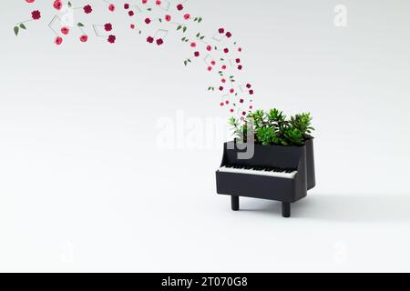 Kreative Komposition von Klavier und Musiknoten aus verschiedenen Blumen auf weißem Hintergrund. Minimales Musikinstrumentkonzept. Trendiges Piano und Colo Stockfoto