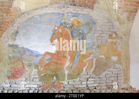 Perugia (Umbrien - PG), San Martino in Campo. Kirche der Madonnuccia Ciribifera (auch „Oratorio della Madonnuccia“ genannt). Freskenzyklus aus der Schule von Perugino (vielleicht ein Schüler von ihm, Andrea d'Assisi). Rechte Wand, St.. George zu Pferd greift den Drachen an Stockfoto