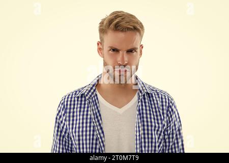 Junger Mann im Studio. Bild eines jungen Mannes mit kariertem Hemd. Junger Mann Stockfoto