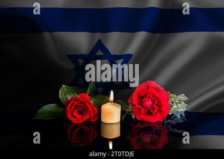 Foto von Flagge und Blumen Stockfoto