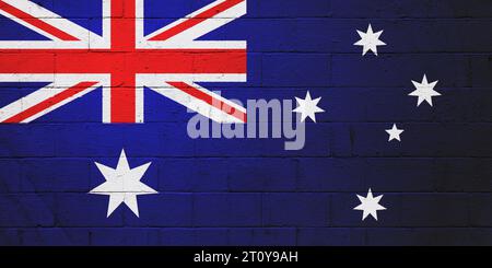Die Flagge Australiens ist auf einer Wand aus einem Schlackenblock gemalt. Stockfoto