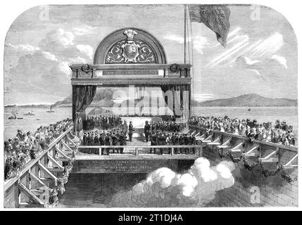 Der Prinz von Wales legt den letzten Stein der Victoria Bridge über die St. Lawrence - aus einer Skizze unseres Spezialkünstlers in Kanada, G. H. Andrews, 1860. '...im Depot der Grand Trunk Railroad... hatte sich eine große Menge versammelt, um die Zeremonie der Grundsteinlegung zu bezeugen... der Zugang zur Brücke war mit Sitzplätzen gesäumt, zu denen Personen nur per Ticket zugelassen wurden. Im Inneren des Widerbaus waren Sitzplätze für die höheren Klassen untergebracht, während die Galerie oben den Familien der Gesetzgeber vorbehalten war. Für den Prinzen wurde ein Gerüst in der Nähe des Komersteins errichtet, der leicht angehoben wurde Stockfoto