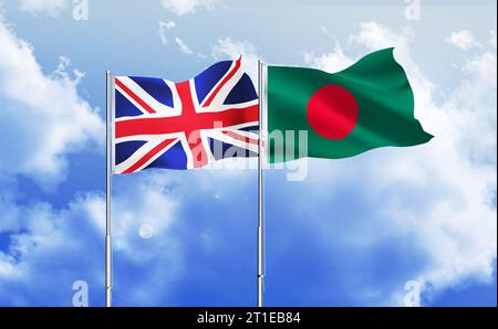 Britische und Bangladesch-Flaggen winken zusammen gegen den blauen Himmel Stockfoto