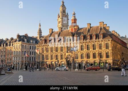 La Vieille Bourse, ornate  Flemish Renaissance stock exchange viewed from the Grand Place in Lille.  Chamber of Commerce belfry tower  stands behind Stock Photo