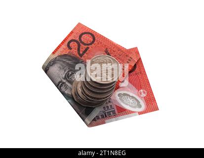 Australische 20-Dollar-Scheine mit einem Stapel Silbermünzen. Beachten Sie, dass Sie sich auf die 20-Cent-Münze konzentrieren. Stockfoto