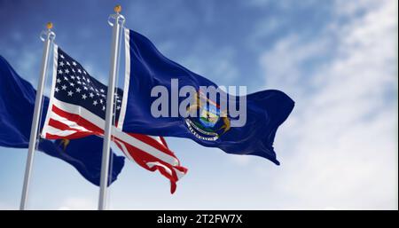 Zwei Flaggen des Bundesstaates Michigan winken im Wind mit der Nationalflagge der Vereinigten Staaten. 3D-Darstellung. Gewelltes Material Stockfoto