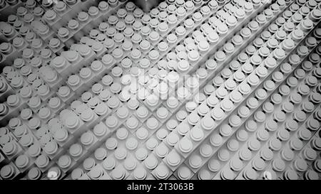 Monochrome, wellenförmige Fliesen auf langen Streifenreihen. Design. Schwarz-weiß wellige Kunststofflinien. Stockfoto