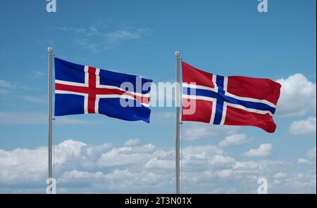 Norwegens und Islands Flaggen schwenken zusammen auf blauem bewölktem Himmel, zwei Länder-Beziehungskonzept Stockfoto