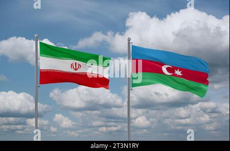 Aserbaidschanische und iranische Flaggen winken zusammen im Wind auf blauem bewölktem Himmel, zwei Länder-Beziehungskonzept Stockfoto