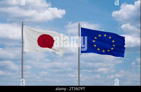 Europäische Union und Japan winken gemeinsam im Wind auf blauem bewölktem Himmel, Beziehungskonzept Stockfoto