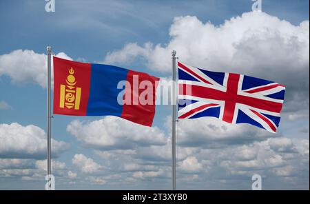 Britische und Mongolei-Fahnen, die zusammen im Wind auf blauem bewölktem Himmel winken, zwei Länder-Beziehungskonzept Stockfoto