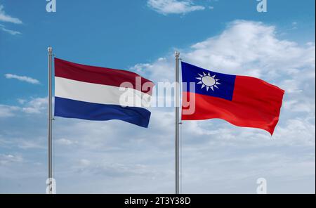 Taiwans und der Niederlande winken zusammen im Wind auf blauem bewölktem Himmel, zwei Länder-Beziehungskonzept Stockfoto