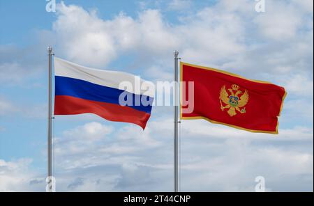 Montenegrinische und russische Fahnen winken zusammen im Wind auf blauem bewölktem Himmel, zwei Länder-Beziehungskonzept Stockfoto