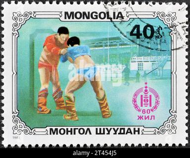 Von der Mongolei gedruckte Briefmarke, die Wrestler zeigt, um 1981. Stockfoto