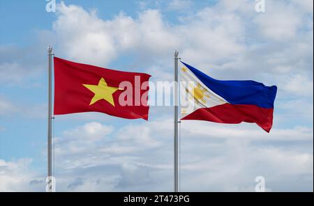 Philippinen- und Vietnam-Flaggen, die zusammen im Wind auf blauem bewölktem Himmel winken, zwei Länder-Beziehungskonzept Stockfoto