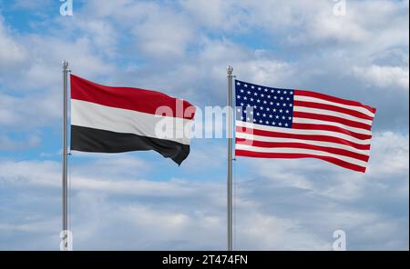 USA- und Jemen-Flaggen winken zusammen im Wind auf blauem bewölktem Himmel, zwei Länder-Beziehungskonzept Stockfoto