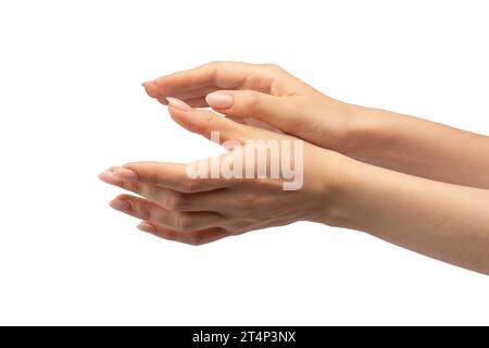 Die Hand einer Frau hält ein winziges oder dünnes Objekt, isoliert auf einem weißen Hintergrund. Stockfoto