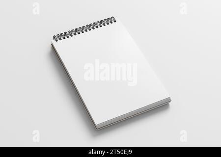Notebook-Modell. Leeres Notebook am Arbeitsplatz. Spiral-Notizblock auf weißem Hintergrund. 3D-Abbildung Stockfoto