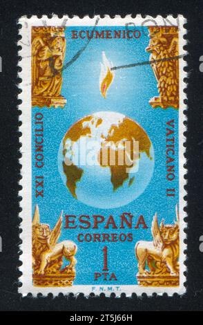 SPANIEN - CA. 1965: Briefmarke von Spanien, zeigt Globe und vier Bestien der Apokalypse, ca. 1965 Stockfoto