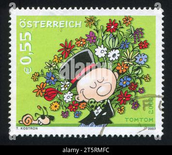 ÖSTERREICH - UM 2003: Briefmarke von Österreich, zeigt Mann mit Blumen, um 2003 Stockfoto