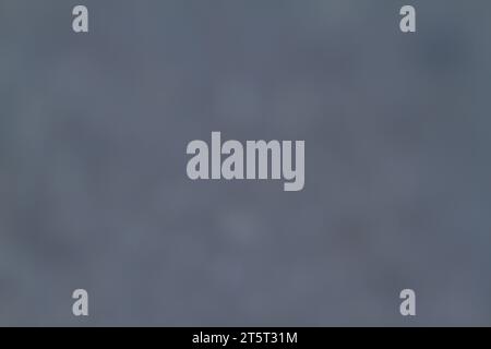 Die Textur ist grau, weich, verschwommen mit kleinen Punkten. Stockfoto