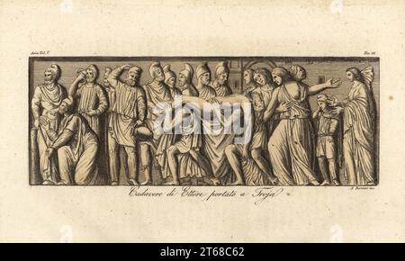 Die Leiche von Hector wurde nach Troy gebracht. Die Trojanischen Soldaten tragen Helme, die an Phrygische Kappen erinnern. Priam kniet links, Hectors Frau Andromache und Sohn Astyanax trauern rechts. Von einem Basrelief auf einem Sarkophag. Cadavere di Ettore portato a Troja. Handkolorierter Kupferstich von Andrea Bernieri aus Giulio Ferrarios Kostüme Alte und Moderne der Völker der Welt, Il Kostüm Antico e Moderno, Florenz, 1847. Stockfoto