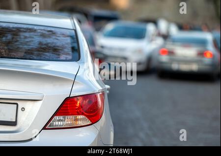 car in big traffic jam. Back view. Blurred background. Selective focus Stockfoto