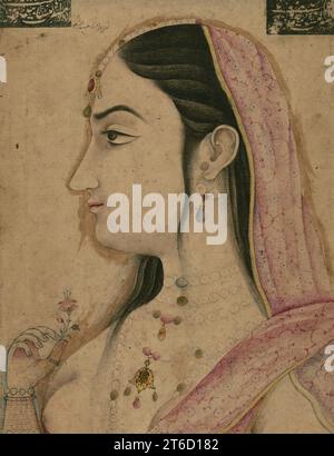 Porträt von Lal Kunwar, 12. Jahrhundert AH/n. Chr. 18. Jahrhundert. Diese Mogul-Farbzeichnung zeigt Lal Kunwar, den Geliebten des 8. Mogul-Kaisers Jahandar Shah (gestorben 1125 AH/1713 n. Chr.). Ursprünglich ein tanzendes Mädchen, wurde sie Jahandars Konkubine und später Königin. Zeitgenössische Historiker bemerkten Jahandar Shahs dekadenten Lebensstil und seine Hingabe an die weibliche Entertainerin Lal Kunwar, die in der Inschrift oben auf der Seite genannt wird. Berichten zufolge hatte Lal Kunwar großen Einfluss auf Jahandars Hof. Die Dichtungen in den oberen Ecken der Seite wurden später hinzugefügt. Stockfoto