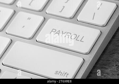 Schaltfläche mit Wort "Lohn- und Gehaltsabrechnung" auf der Tastatur, Nahaufnahme Stockfoto