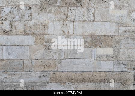 Textur, Wand, Beton, kann als Hintergrund verwendet werden. Wandfragment mit Kratzern und Rissen Stockfoto