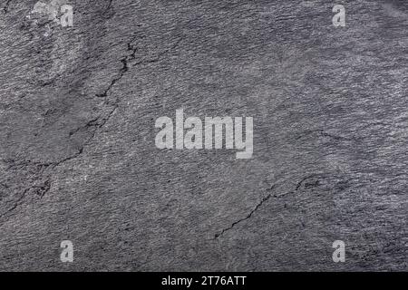 Natursteinstruktur, QUARZIT BEOLA NERA Scheibe, graue Farbe mit verschiedenen kleinen und großen Rissen Stockfoto